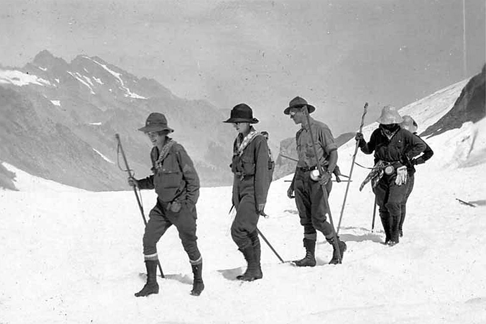 Men and women in snow during ascent of Mount Olympus, August 11, 1920