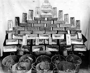 Gold bricks and buckets of gold ore belonging to the Miner's and Merchant's Bank