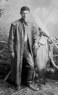 Fisherman with salmon, ca. 1897