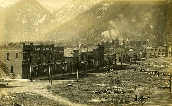 Black and white, fairly distant oblique angle photographic image of Main Street in Leavenworth, Chelan County, WA, ca. 1910