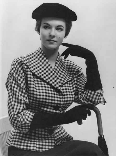 Portrait of a woman in a plaid suit