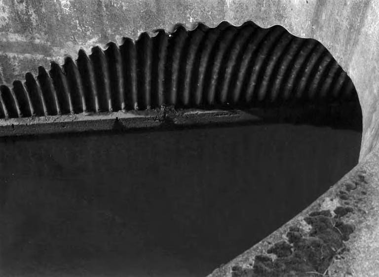 Rippling [detail of concrete culvert carrying water]
