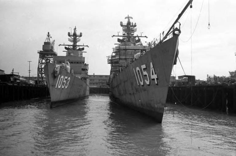 Large navy ships docked at the Seattle waterfront