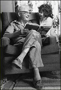 John L. Miller reading to young girl Shoshanna Lurie, Seattle, 1975