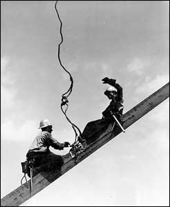 Workers erecting steel beams